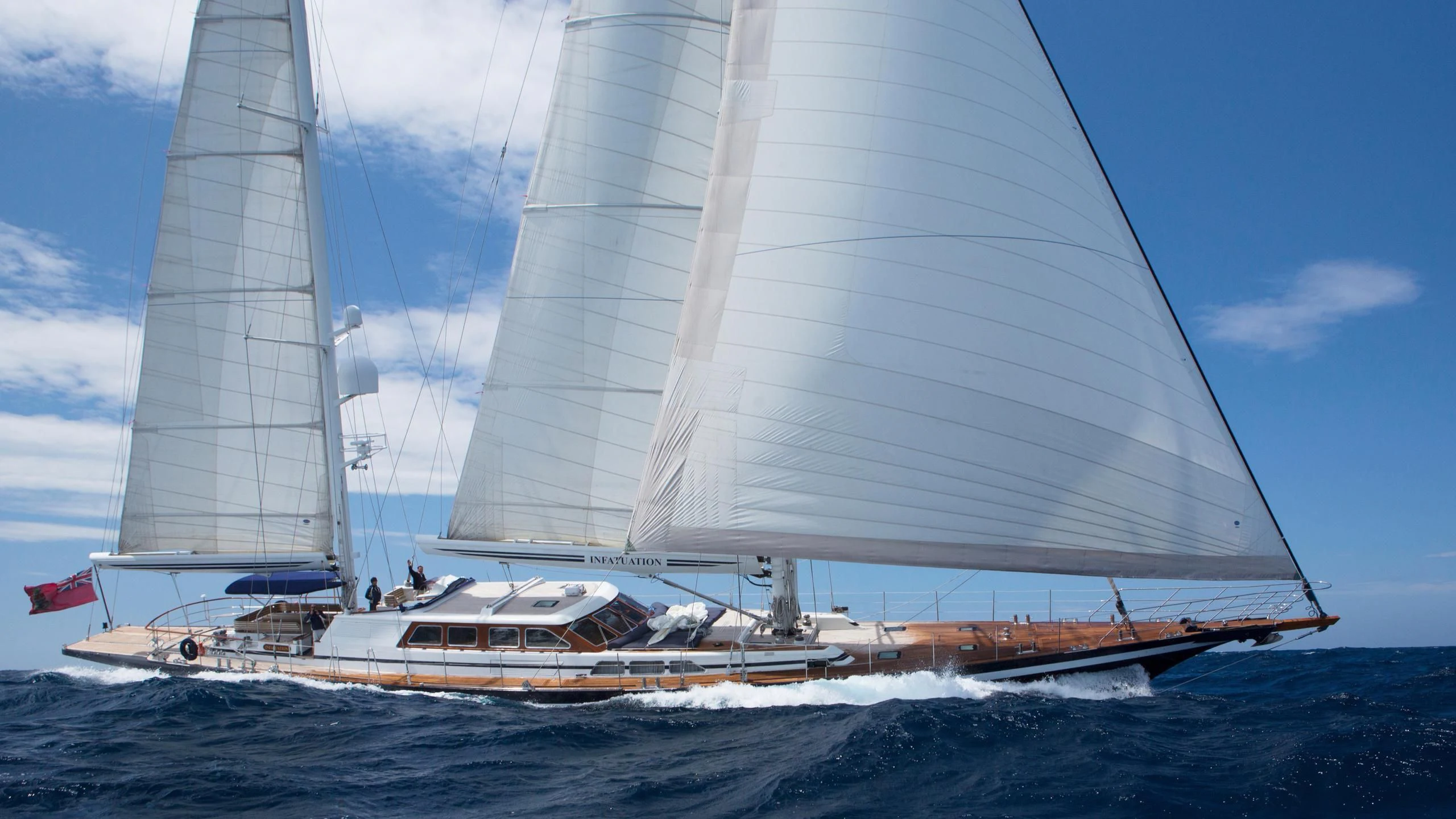 a boat sailing on the sea aboard INFATUATION Yacht for Sale