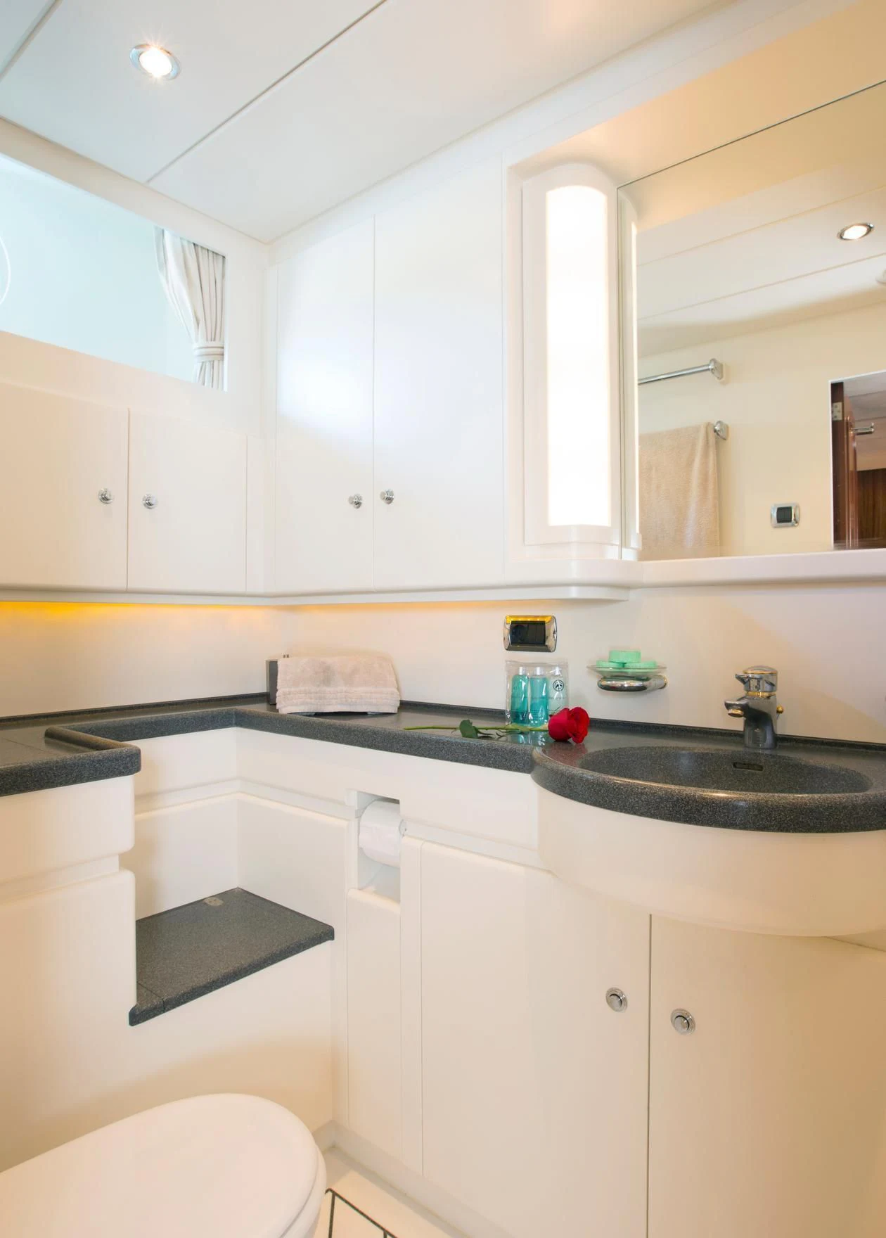 a bathroom with white cabinets aboard INFATUATION Yacht for Sale