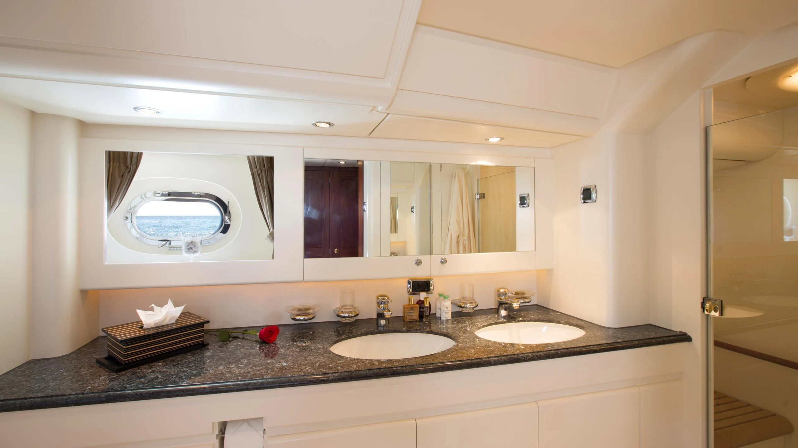 a bathroom with sinks and mirrors aboard INFATUATION Yacht for Sale