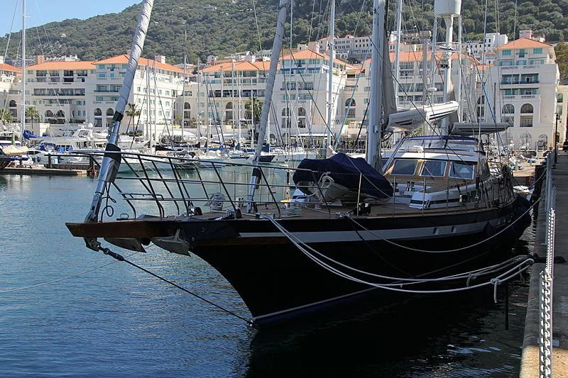 a boat docked at a pier aboard INFATUATION Yacht for Sale