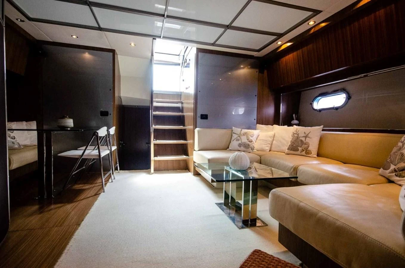 a living room with a ladder aboard ALTER EGO Yacht for Sale
