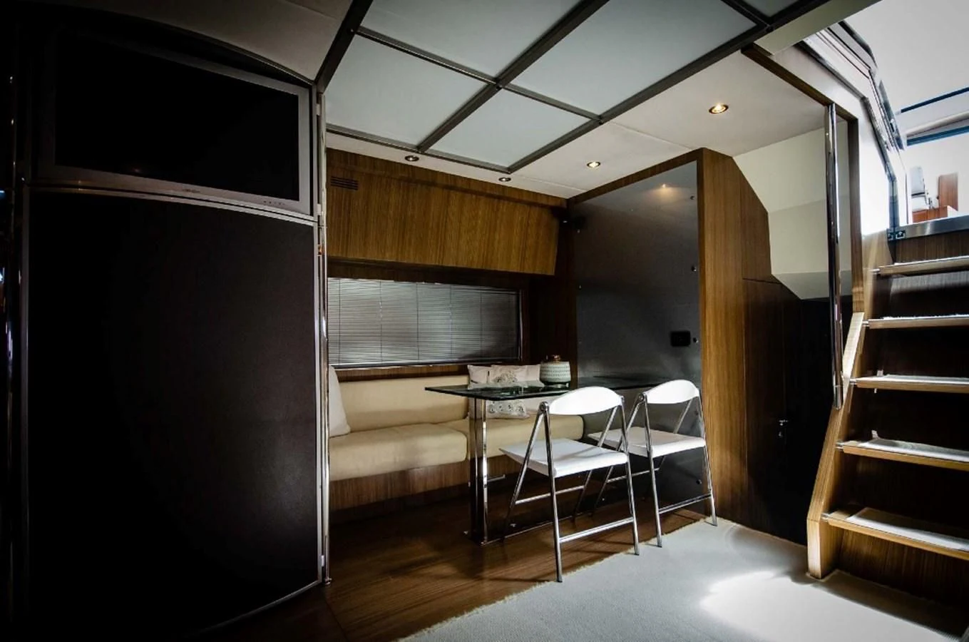 a room with a table and chairs aboard ALTER EGO Yacht for Sale