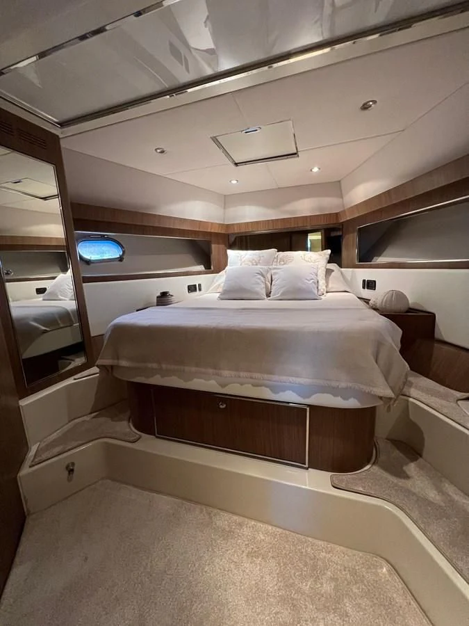 a room with a bed and a mirror aboard ALTER EGO Yacht for Sale