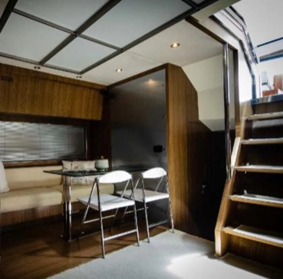 a room with a table and chairs aboard ALTER EGO Yacht for Sale