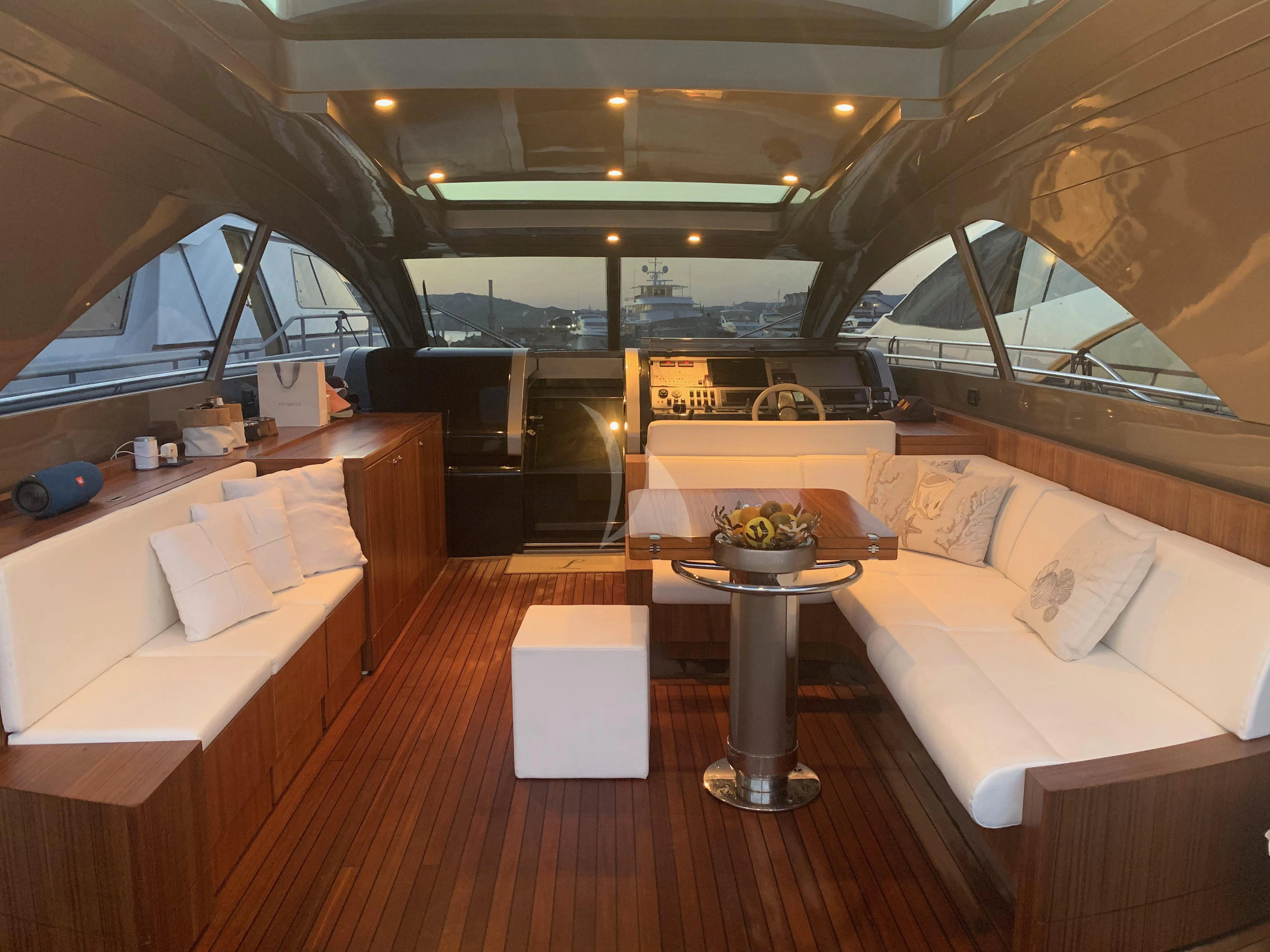 a room with a table and couches aboard ALTER EGO Yacht for Sale