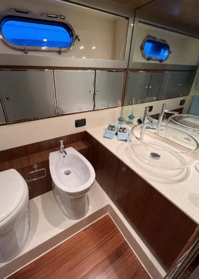 a bathroom with a sink and a toilet aboard ALTER EGO Yacht for Sale