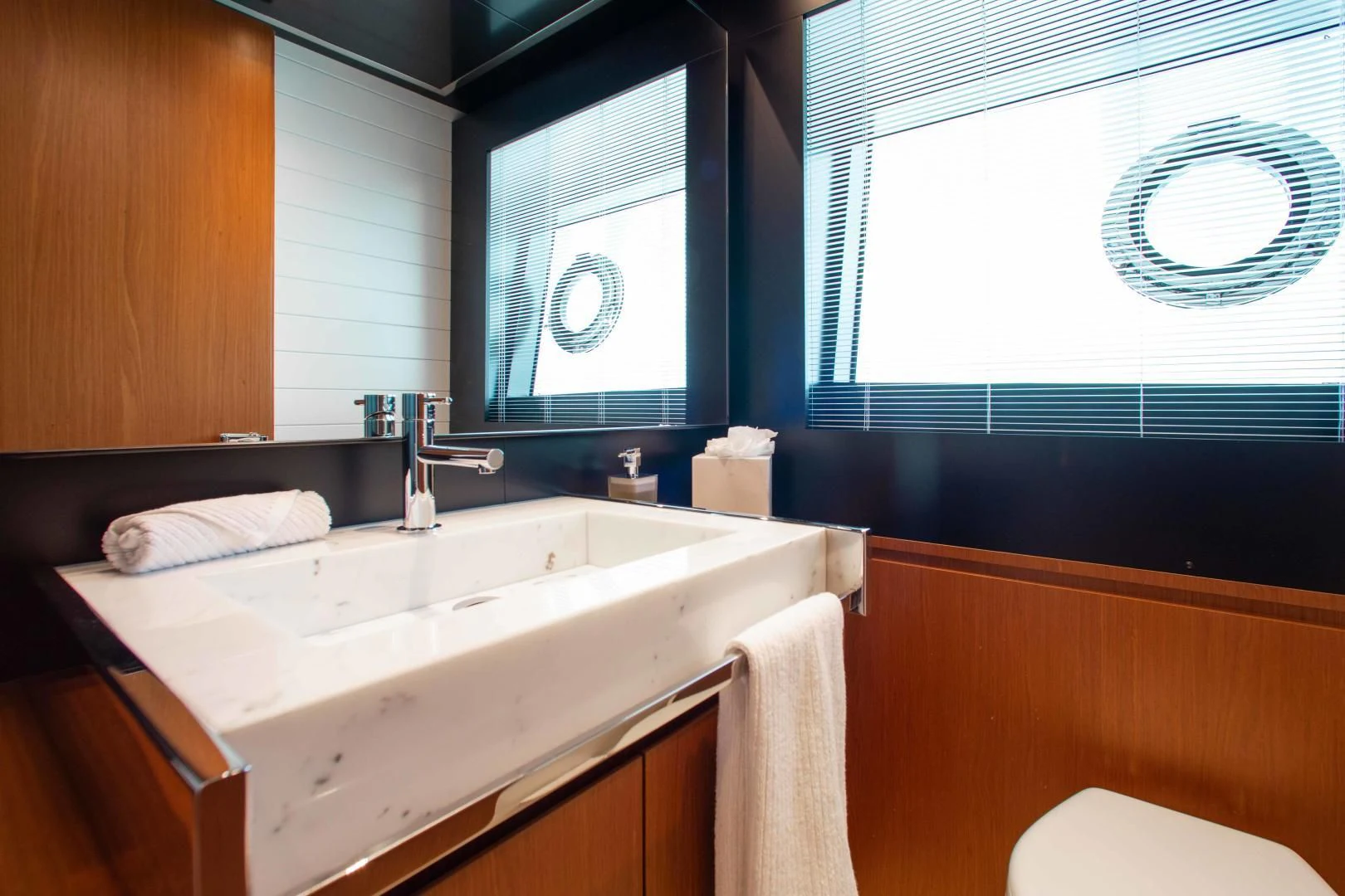 a bathroom with a sink and a mirror aboard KIYOMIZU Yacht for Sale