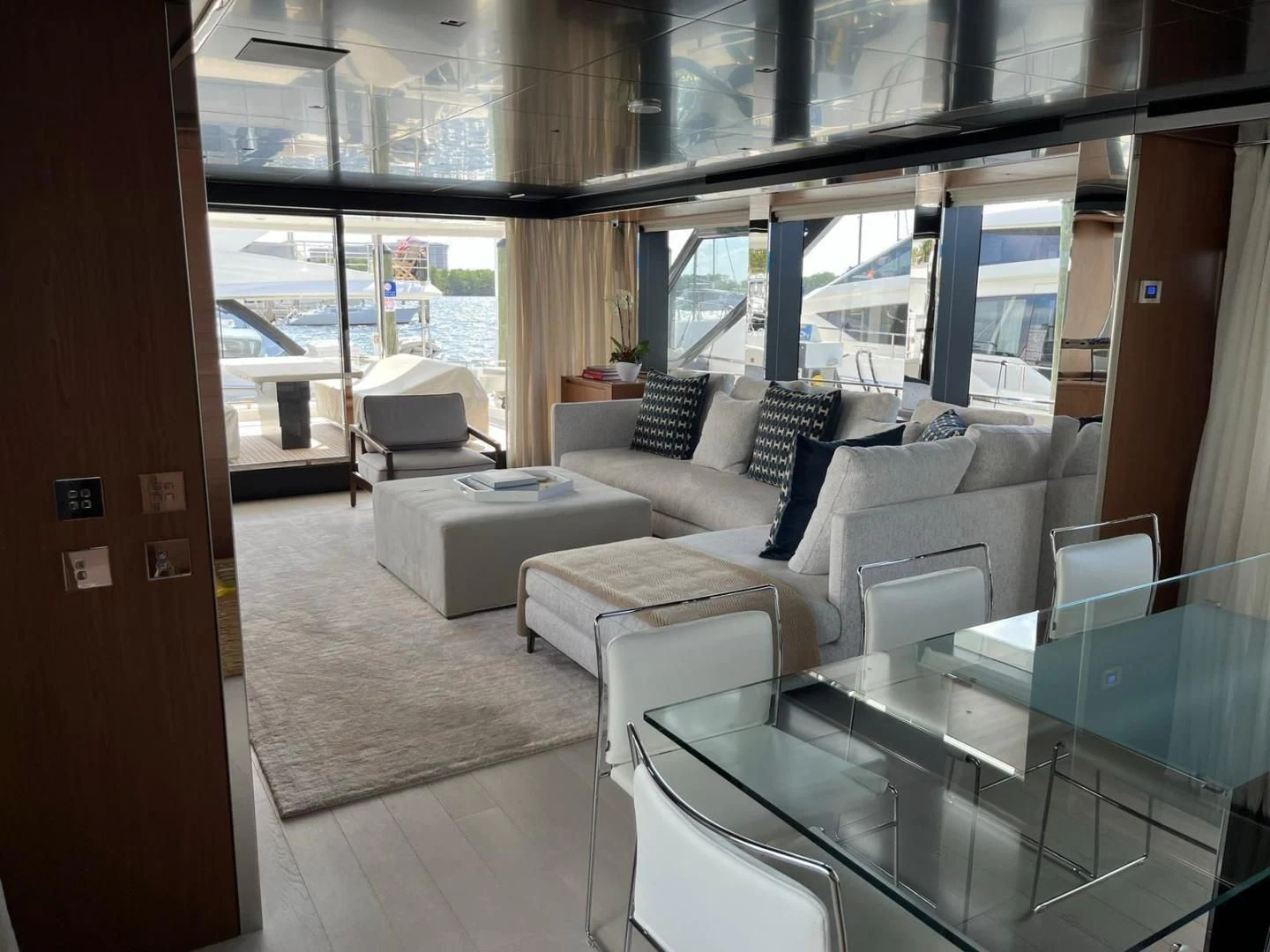 a room with a table chairs and a window aboard KIYOMIZU Yacht for Sale