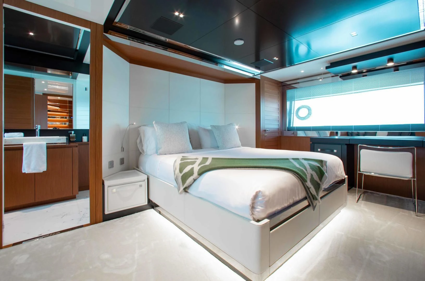 a room with a bed and a desk aboard KIYOMIZU Yacht for Sale