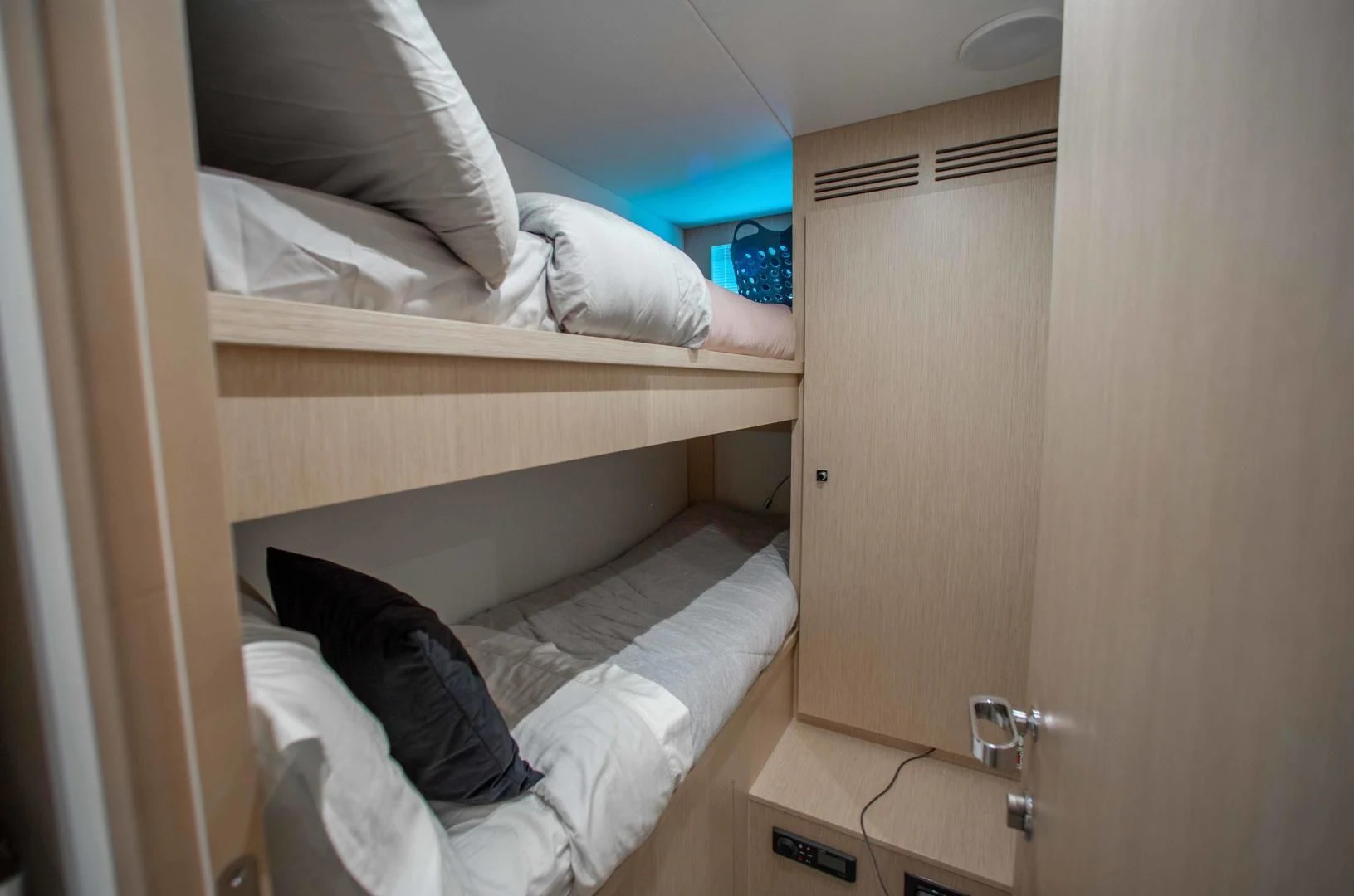 a room with a bed and a desk aboard KIYOMIZU Yacht for Sale