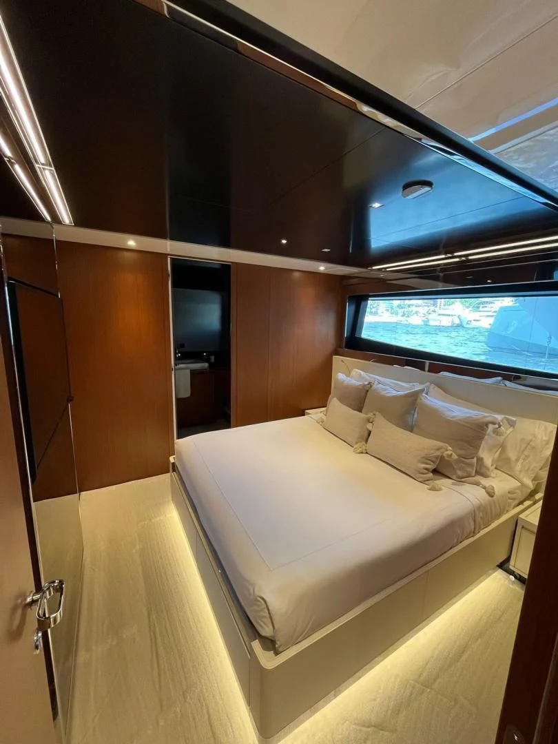 a room with a bed and a tv aboard KIYOMIZU Yacht for Sale