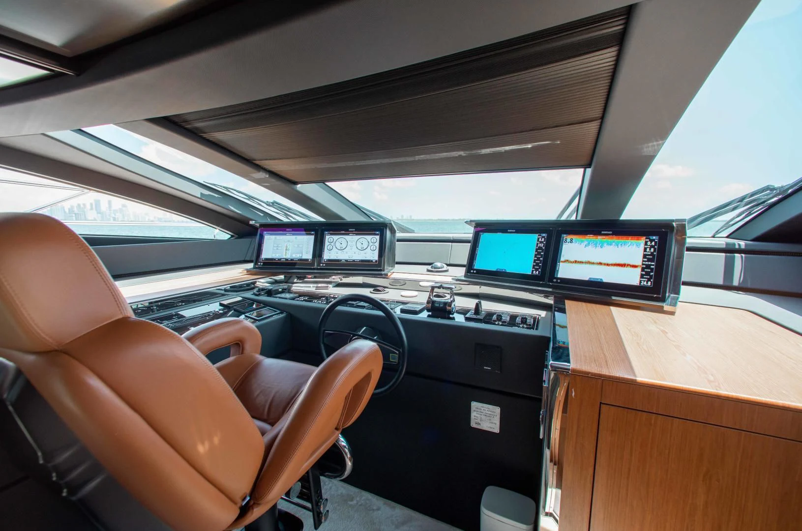 a person sitting in a car aboard KIYOMIZU Yacht for Sale