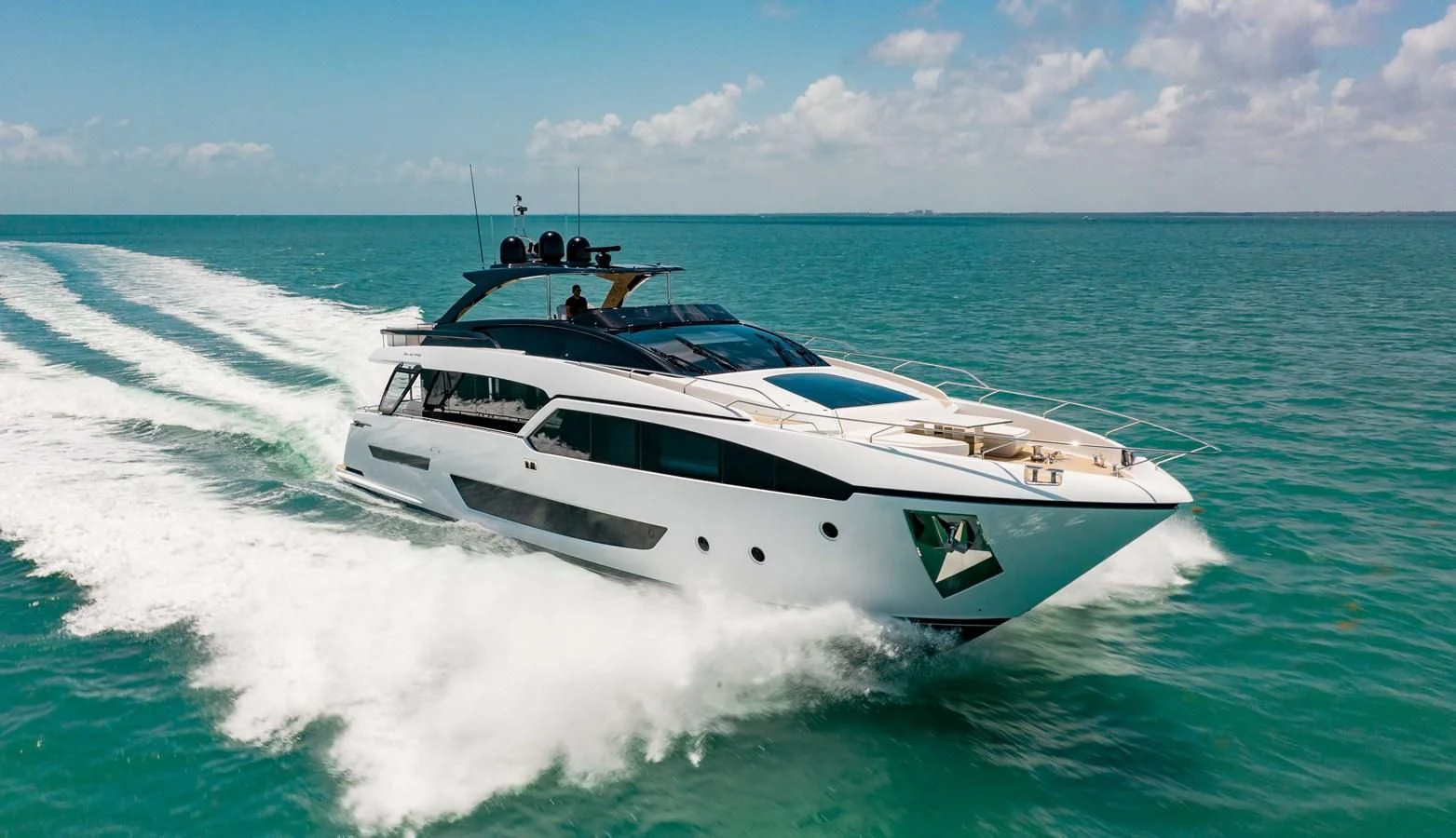 a white yacht on the water aboard KIYOMIZU Yacht for Sale