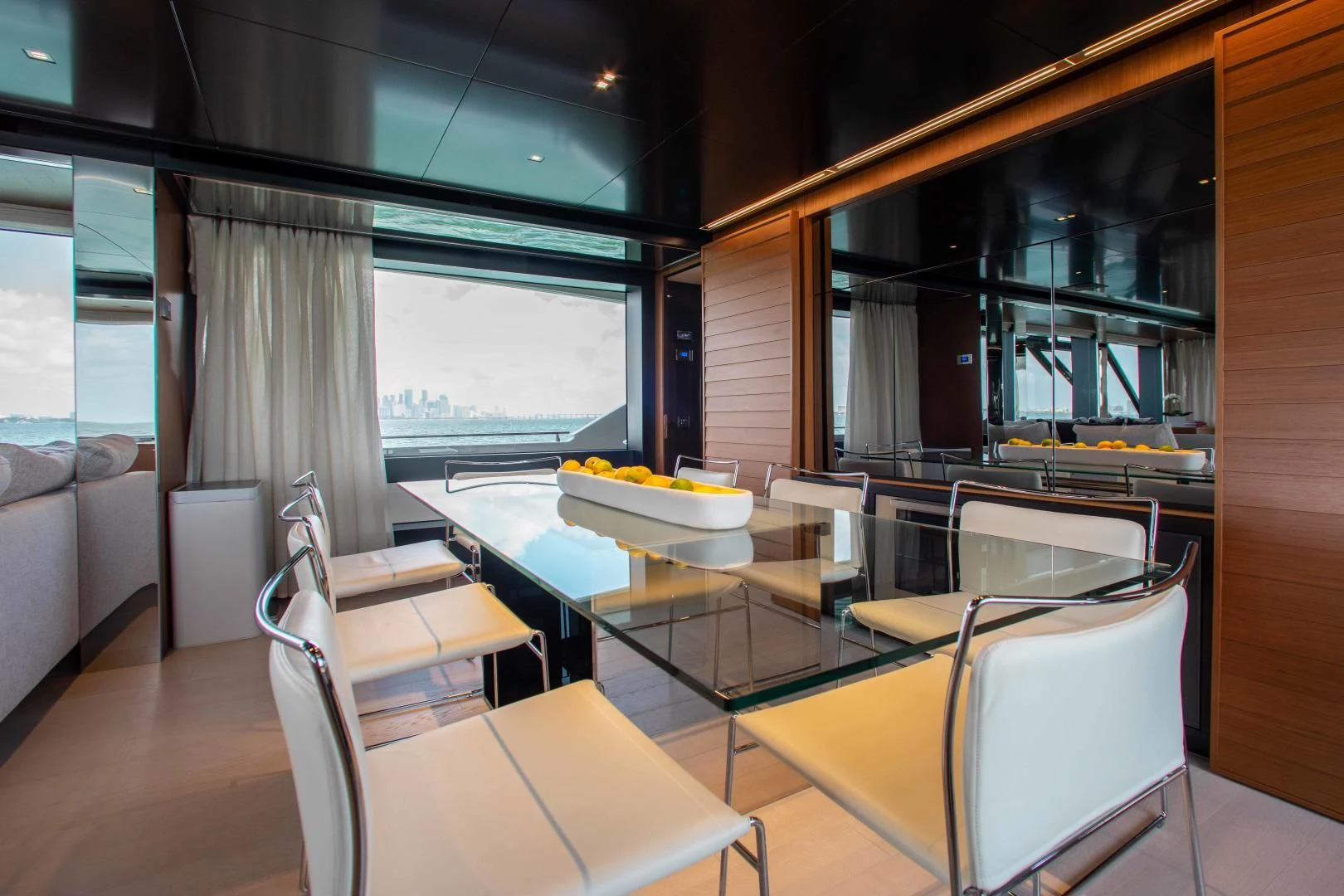 a room with a table chairs and a window aboard KIYOMIZU Yacht for Sale