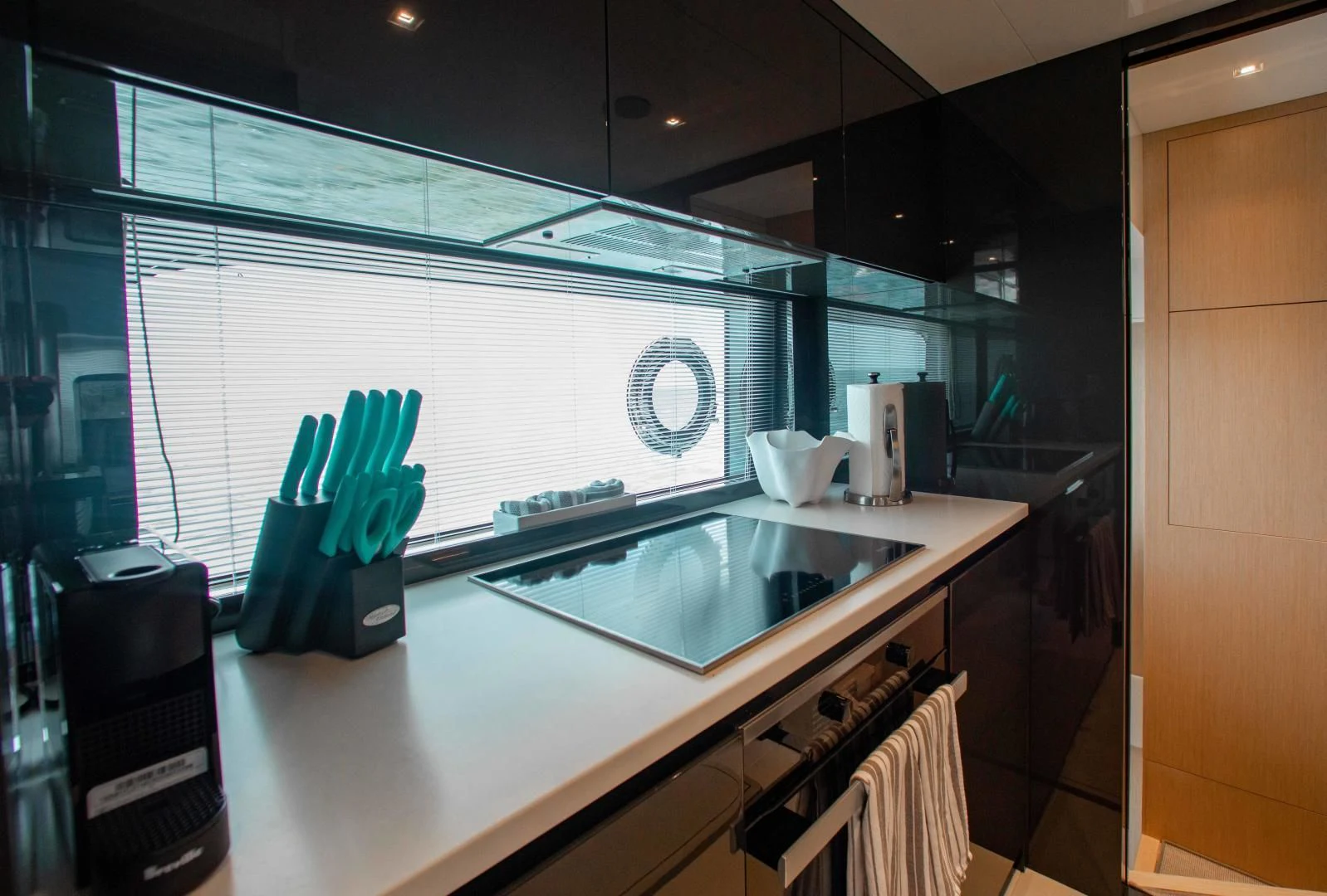 a kitchen with a sink and cabinets aboard KIYOMIZU Yacht for Sale
