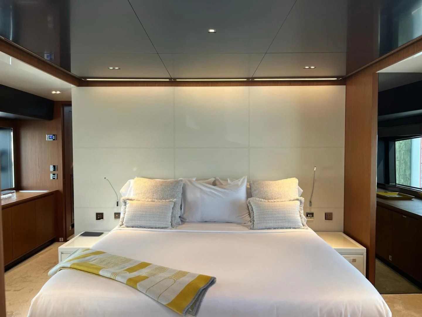 a bed with white pillows aboard KIYOMIZU Yacht for Sale