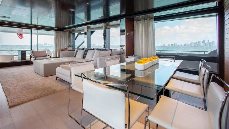 a room with a table chairs and a large window aboard KIYOMIZU Yacht for Sale