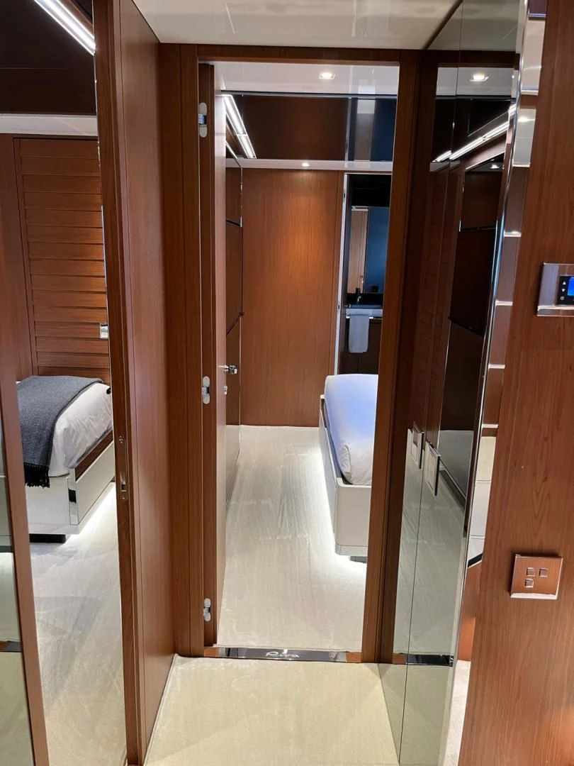 a room with a bed and a closet aboard KIYOMIZU Yacht for Sale