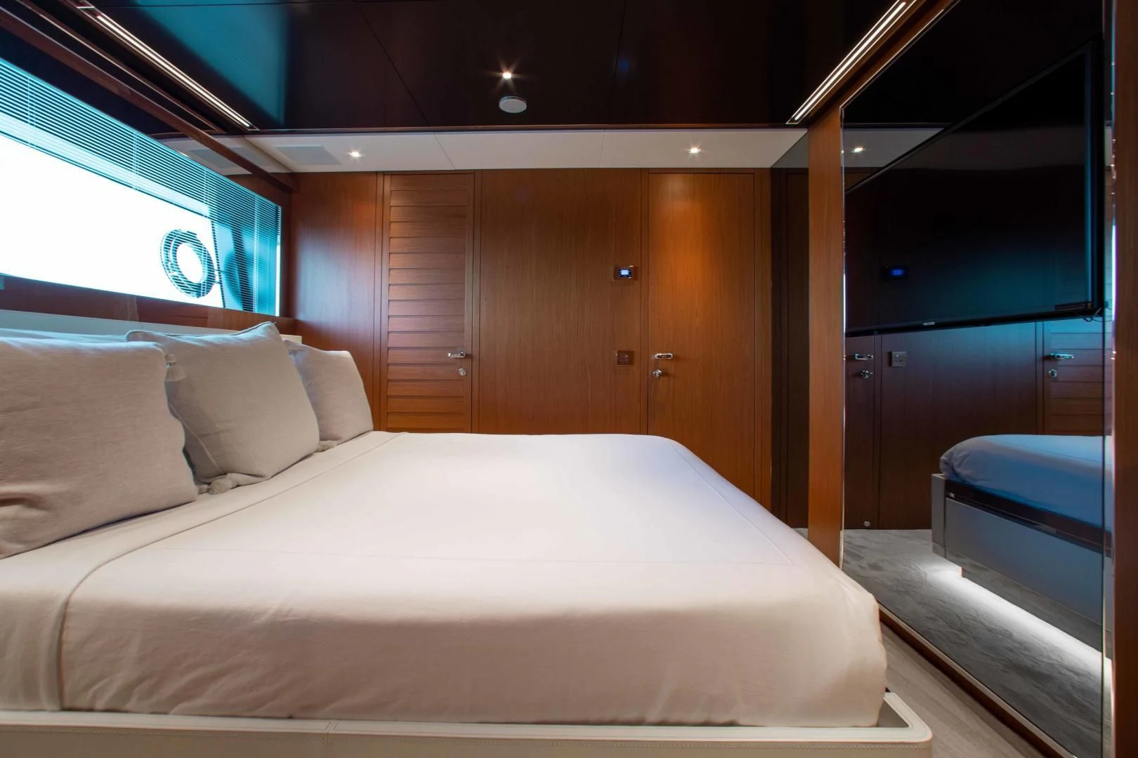 a bed with white sheets aboard KIYOMIZU Yacht for Sale