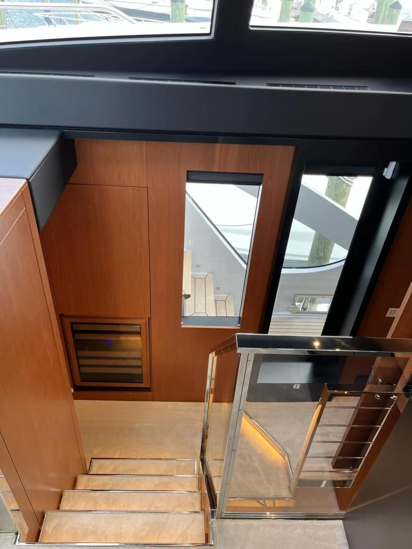 a wooden staircase in a building aboard KIYOMIZU Yacht for Sale