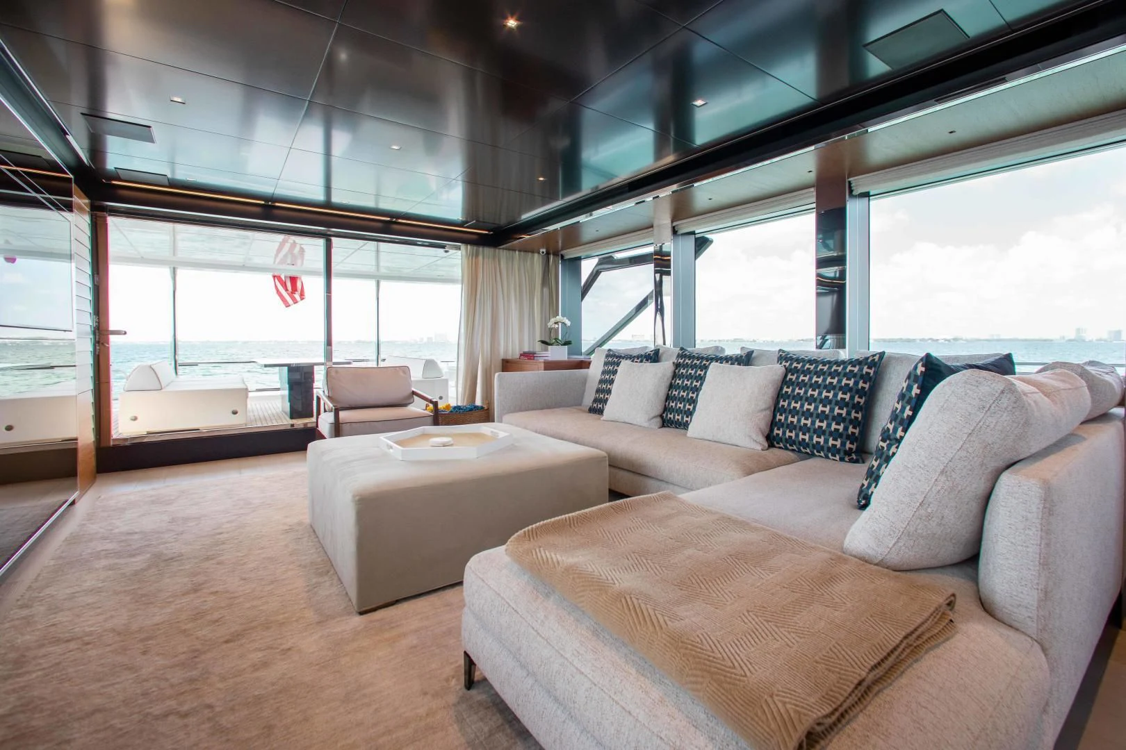 a room with couches and a bed aboard KIYOMIZU Yacht for Sale
