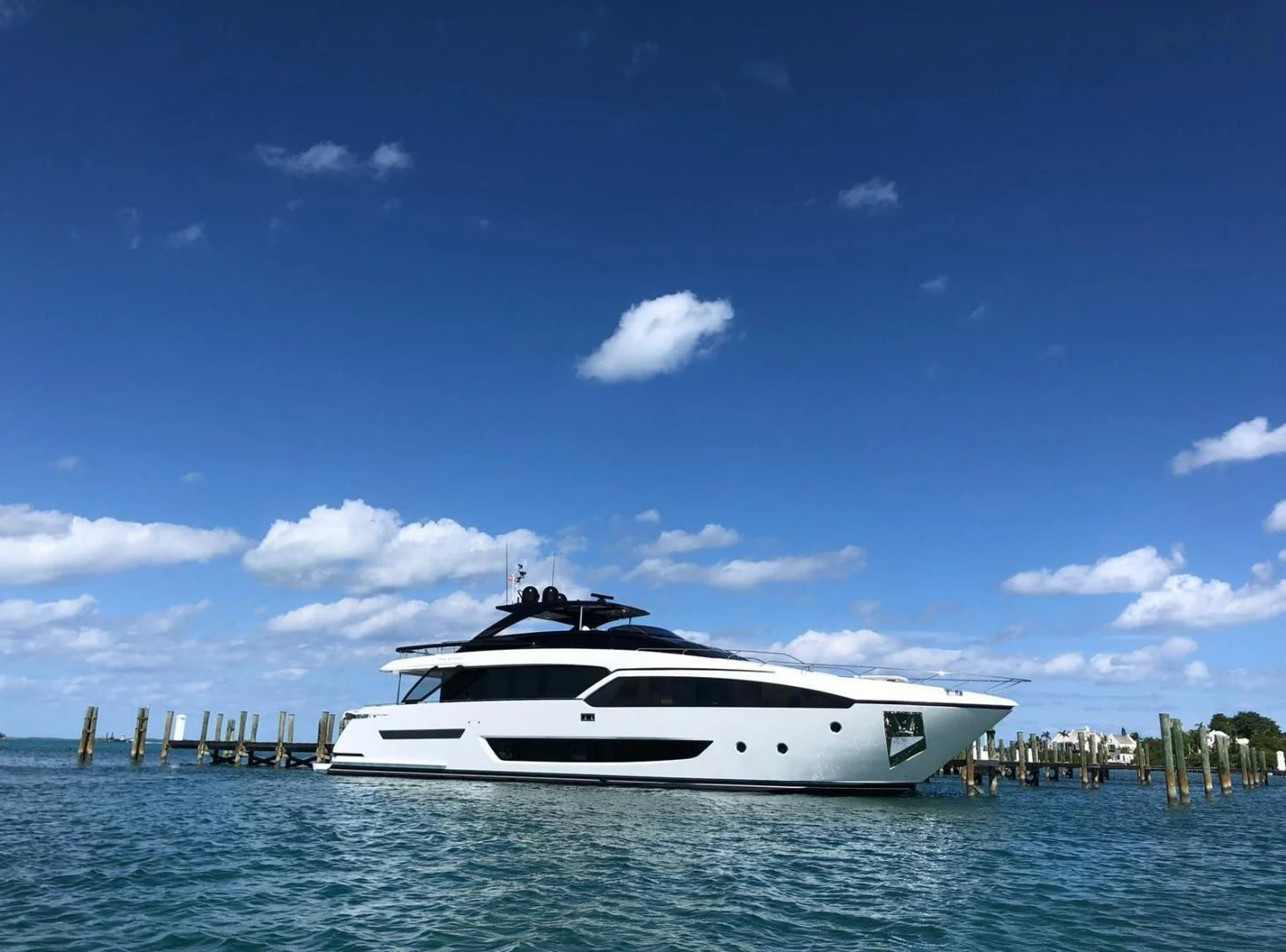 a white yacht in the water aboard KIYOMIZU Yacht for Sale
