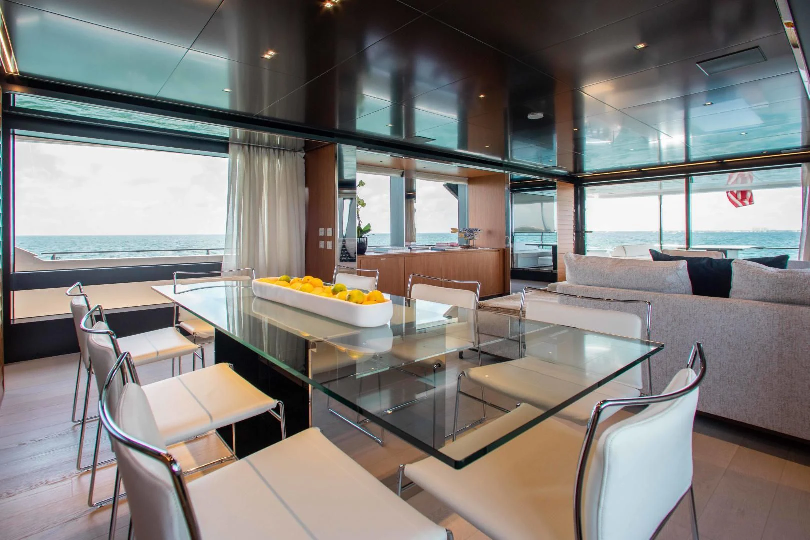 a room with a table and chairs aboard KIYOMIZU Yacht for Sale
