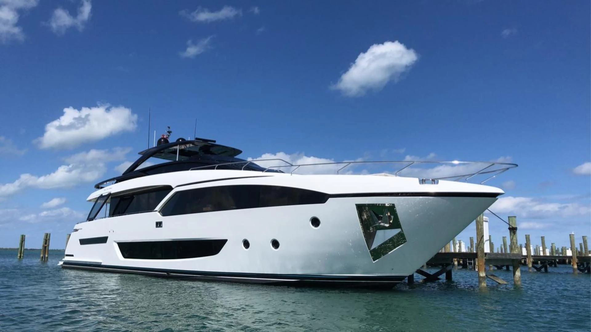 a white yacht in the water aboard KIYOMIZU Yacht for Sale