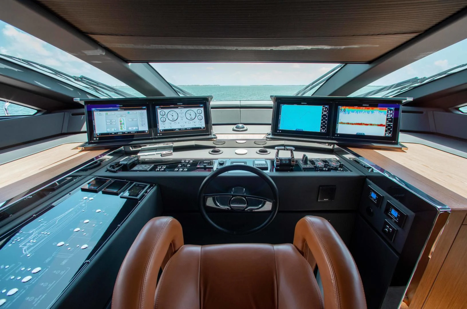 inside of a car with monitors and seats aboard KIYOMIZU Yacht for Sale