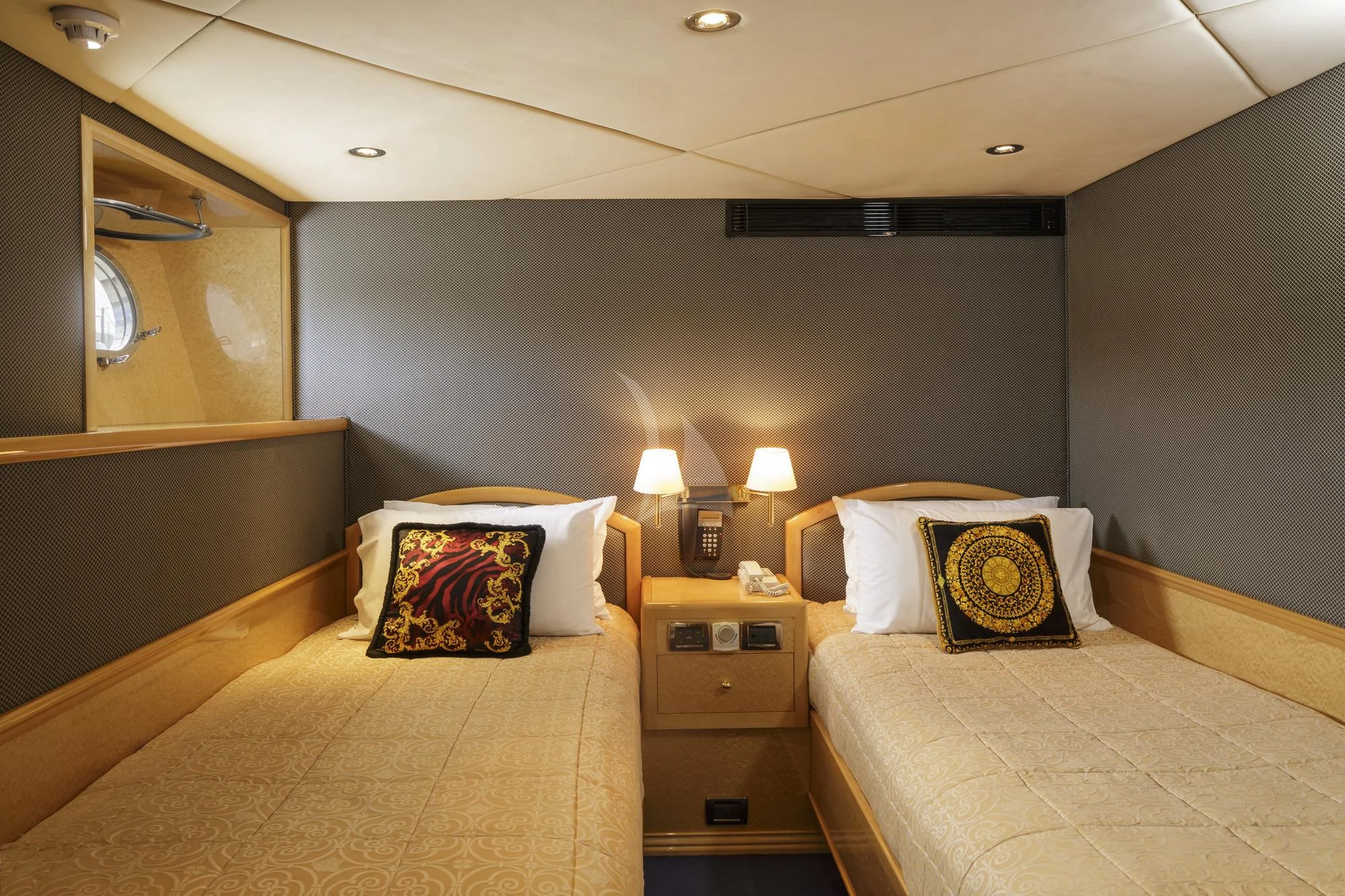 a bedroom with two beds aboard FLYING FISH Yacht for Sale