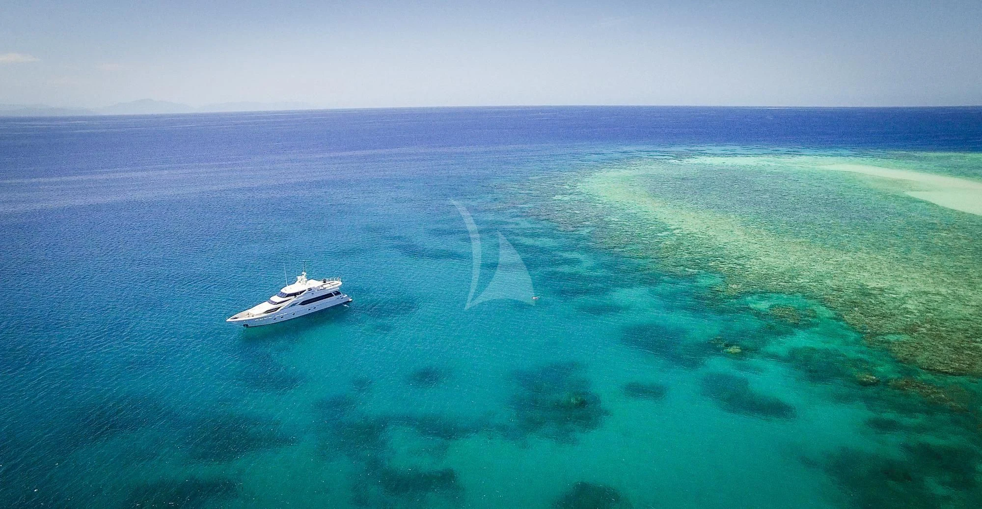 a boat in the ocean aboard FLYING FISH Yacht for Sale