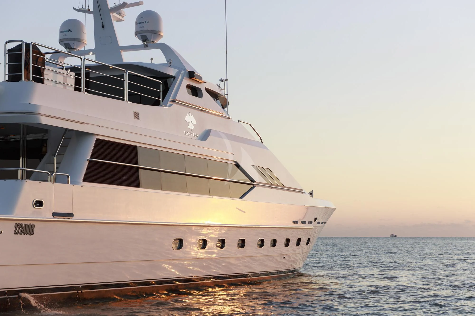 a large white boat on the water aboard FLYING FISH Yacht for Sale