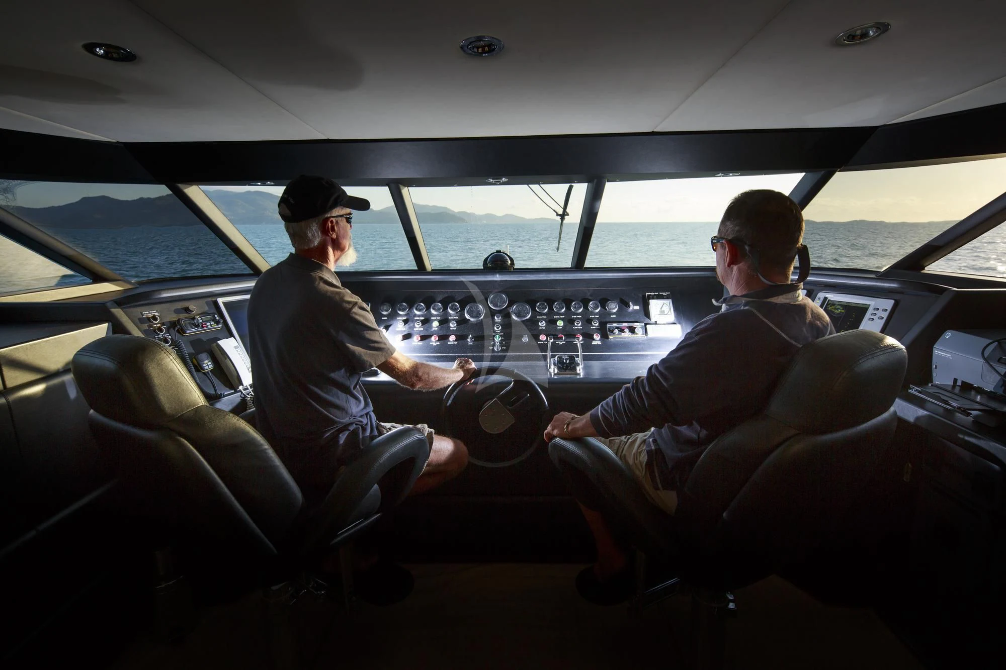 men in a car aboard FLYING FISH Yacht for Sale