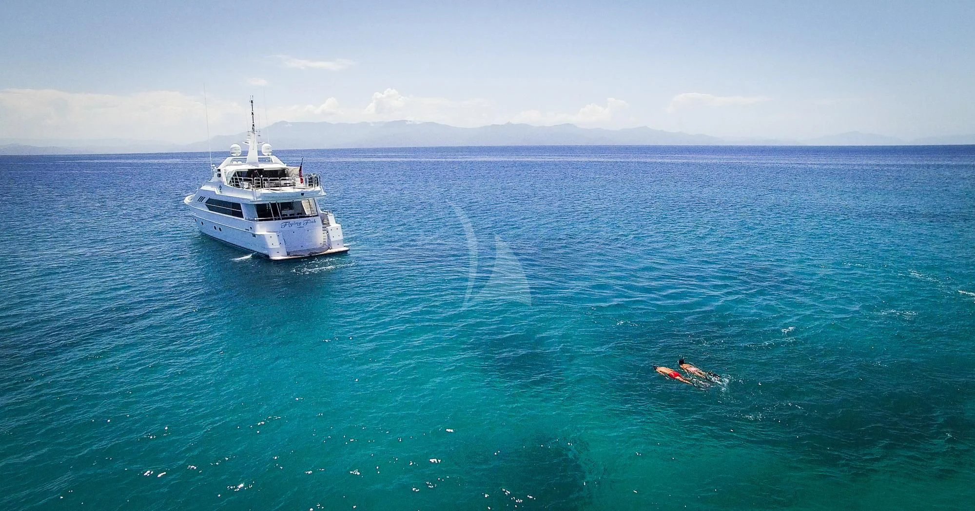 a boat in the water aboard FLYING FISH Yacht for Sale