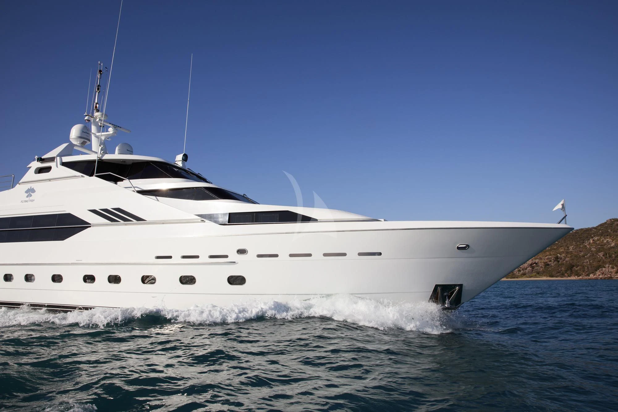 a white yacht on the water aboard FLYING FISH Yacht for Sale