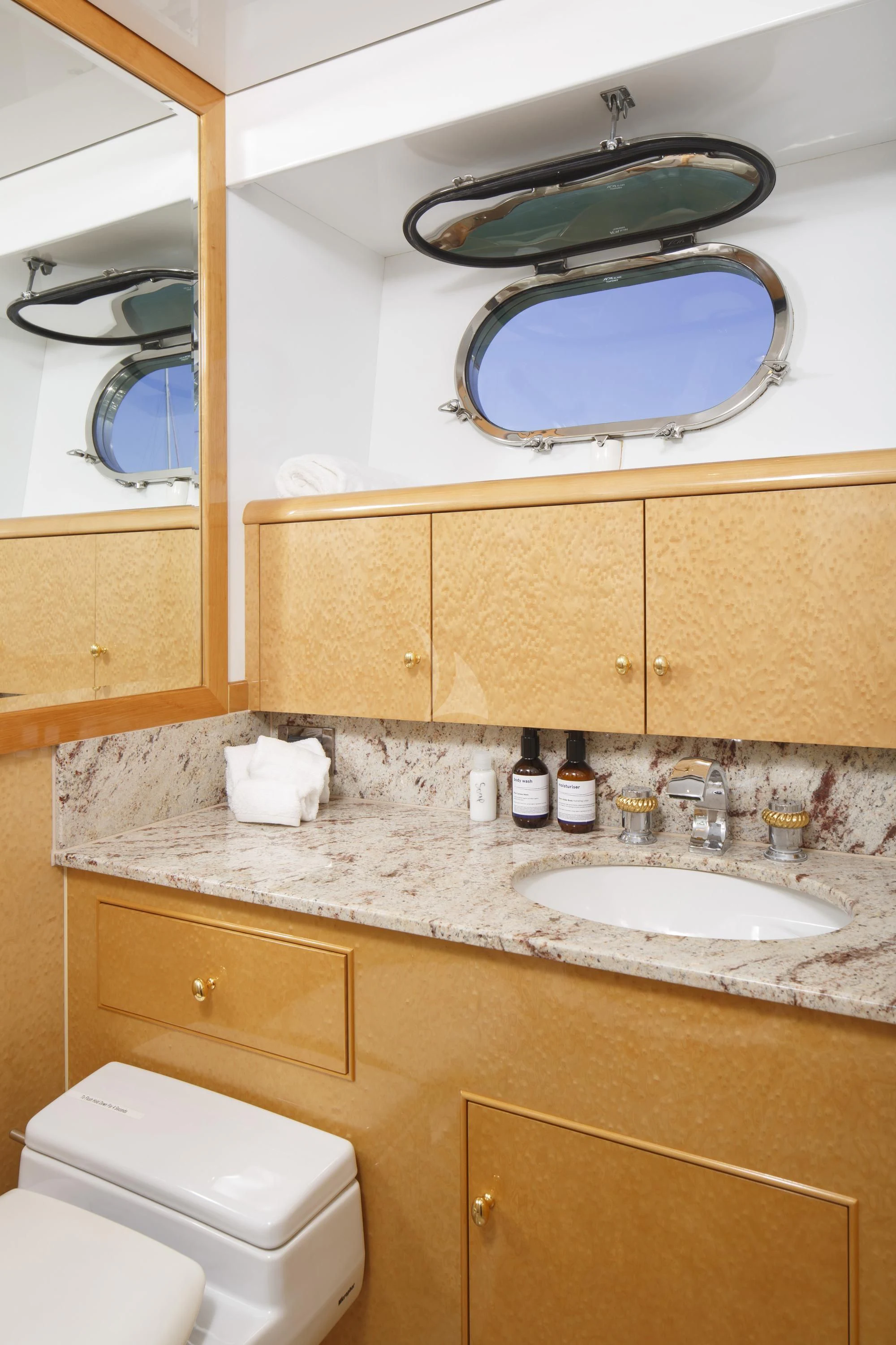 a bathroom with a sink and a mirror aboard FLYING FISH Yacht for Sale