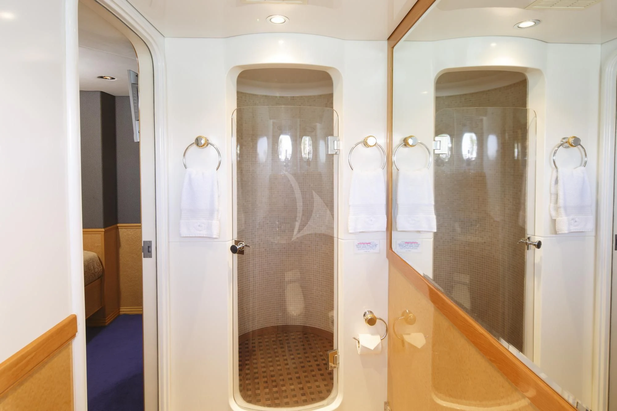 a bathroom with a glass shower aboard FLYING FISH Yacht for Sale