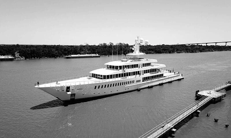 a large white boat on a body of water aboard FOUNTAINHEAD Yacht for Sale