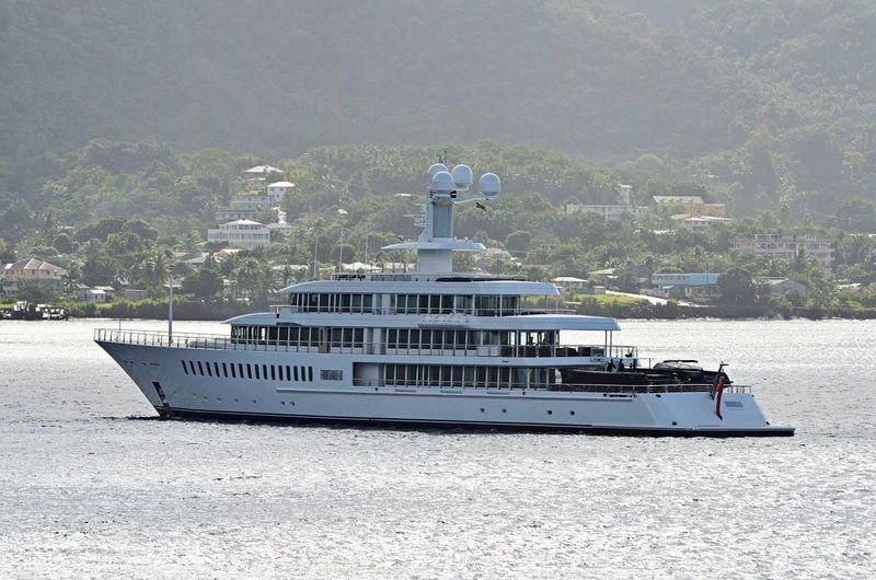 a large white boat on the water aboard FOUNTAINHEAD Yacht for Sale