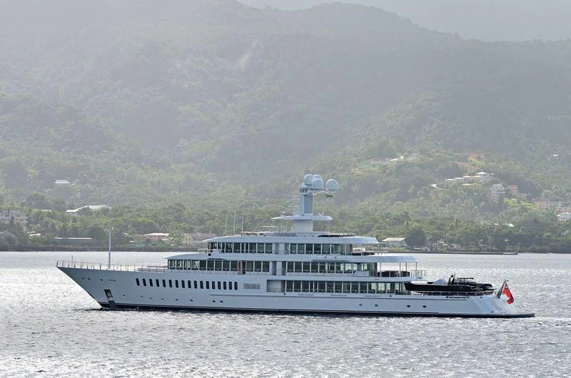 a large white boat in the water aboard FOUNTAINHEAD Yacht for Sale