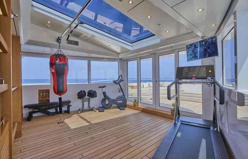 a room with a large gym aboard DYTAN Yacht for Sale
