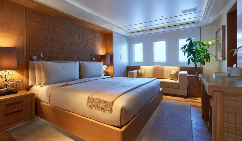 a large bedroom with a large bed aboard DYTAN Yacht for Sale