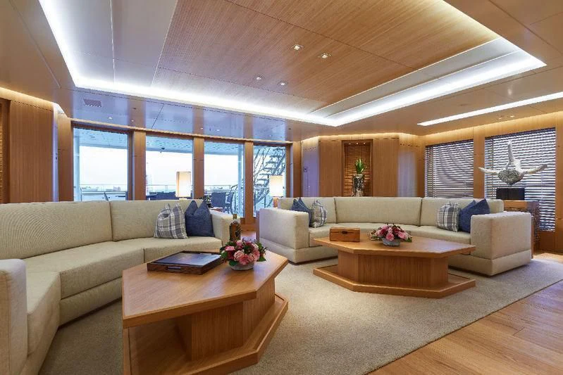 a living room with a large window aboard DYTAN Yacht for Sale