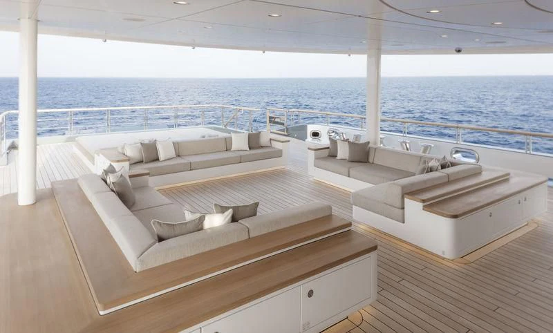 a room with a couch and a large body of water aboard DYTAN Yacht for Sale