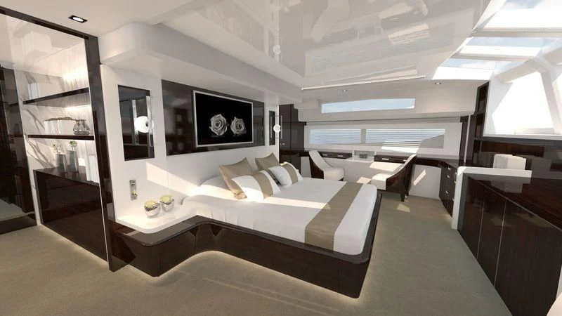 a room with a bed and a desk aboard AMIRA Yacht for Sale