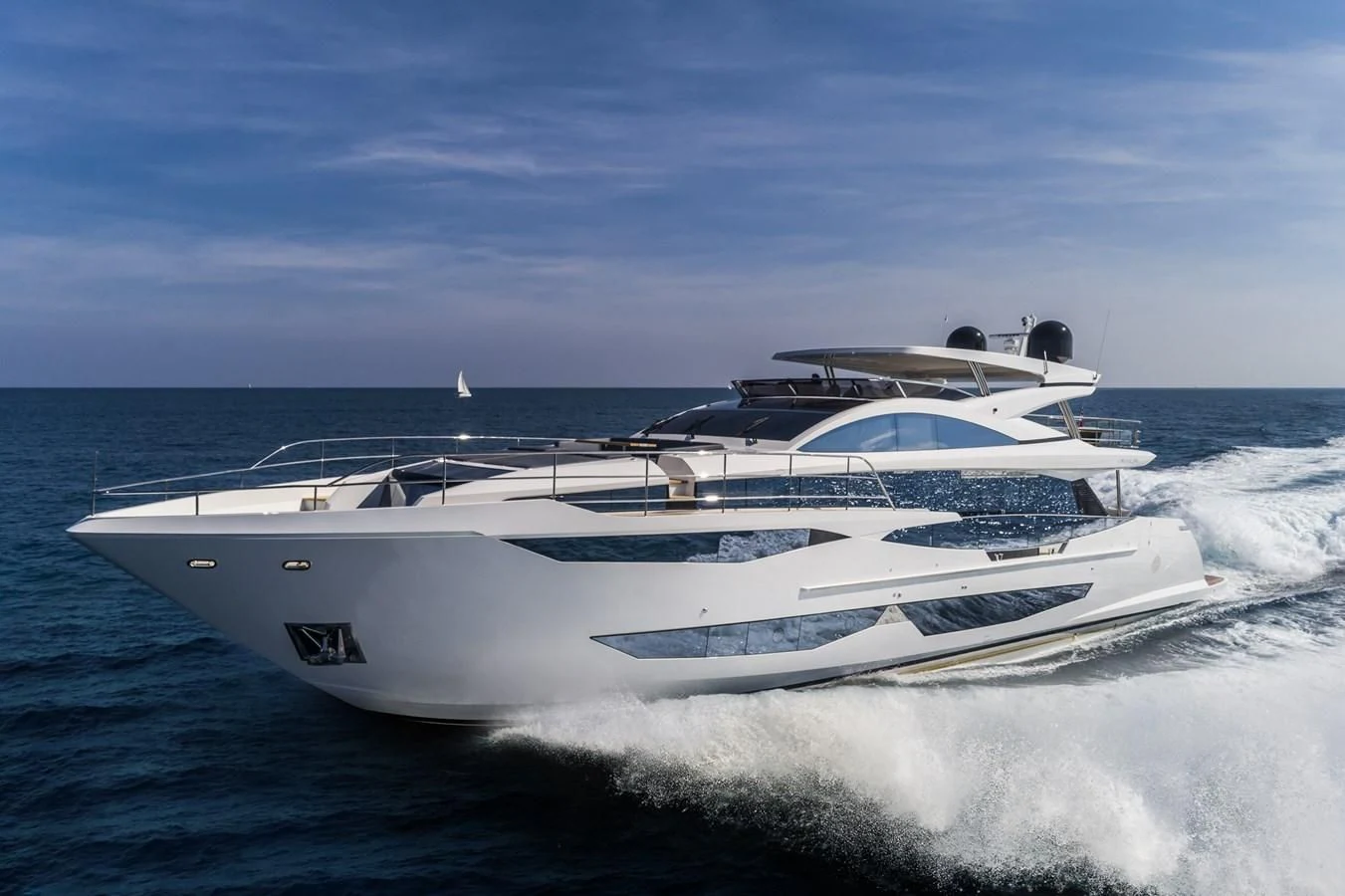 a white yacht on the water aboard AMIRA Yacht for Sale