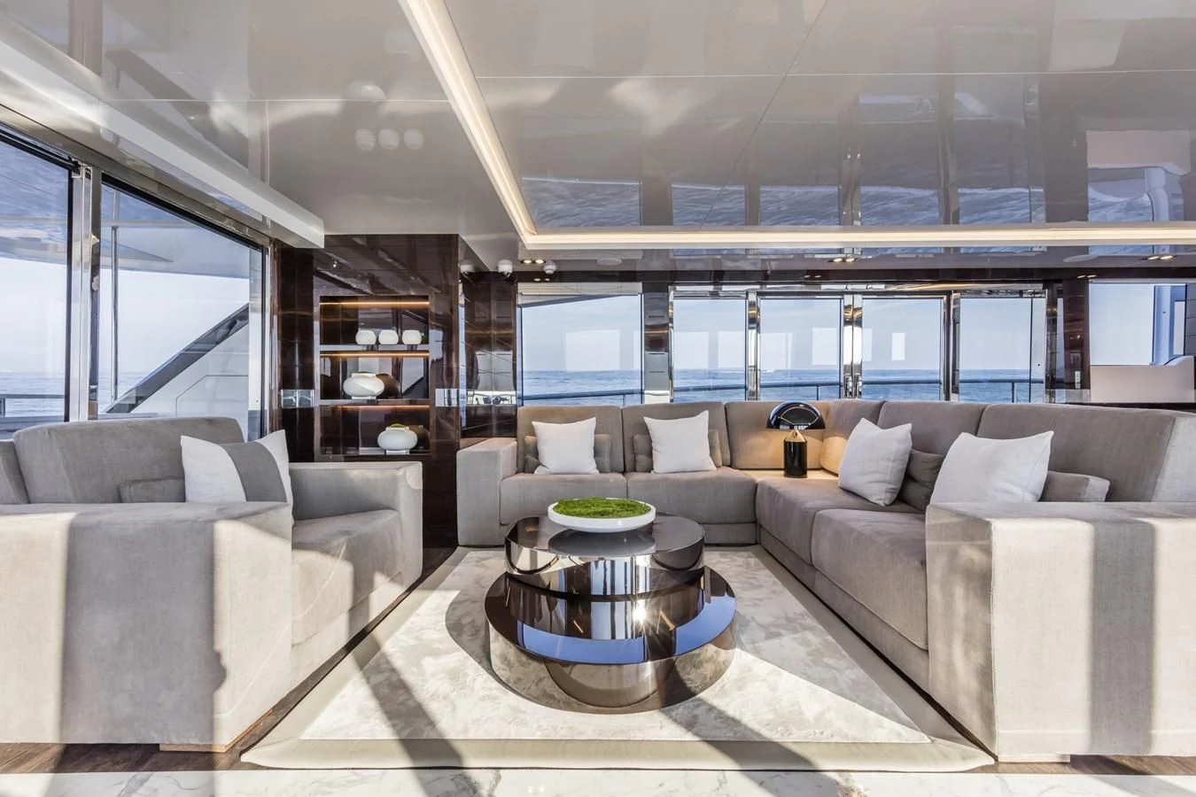 a living room with a large window aboard AMIRA Yacht for Sale