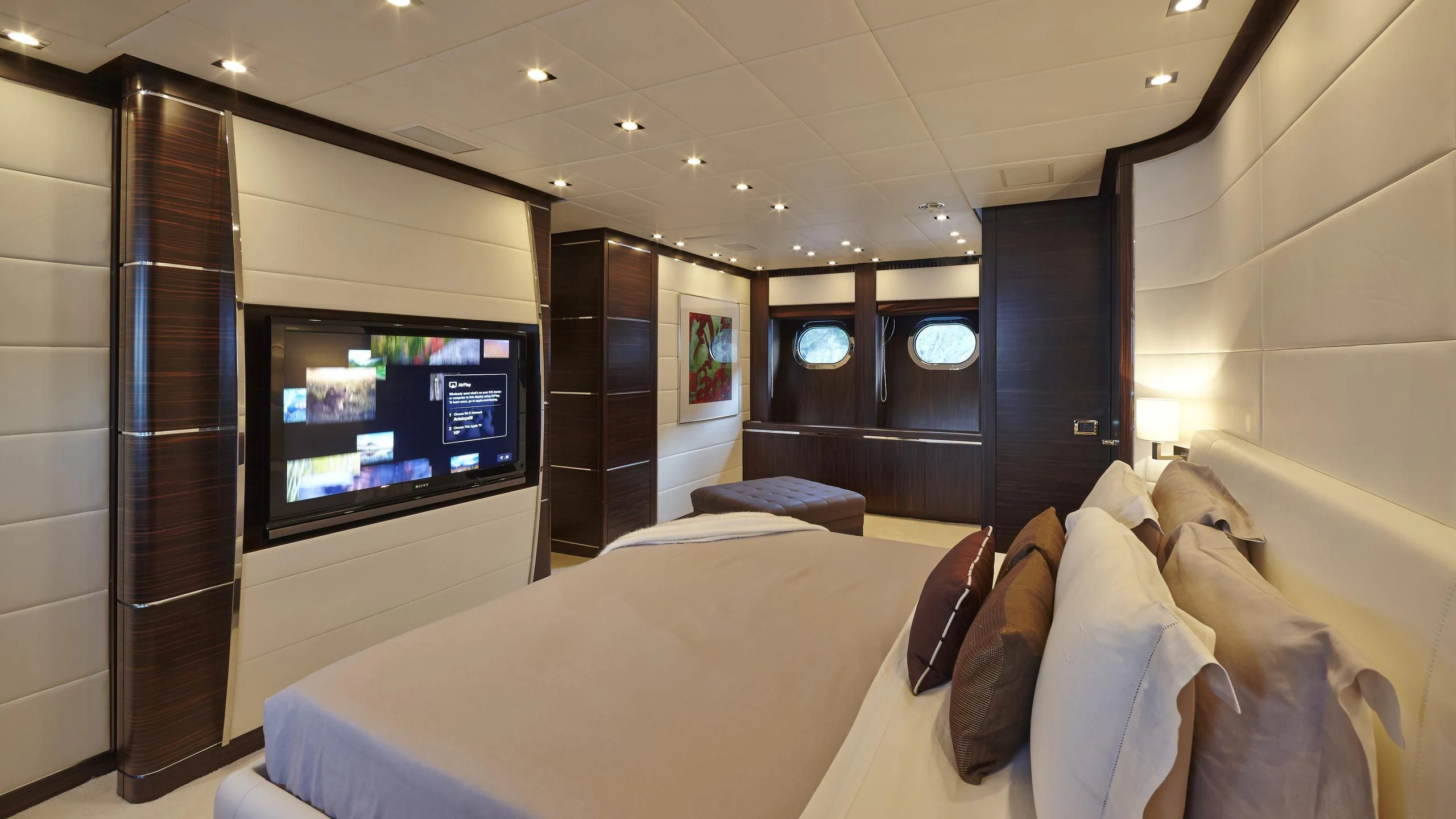 a room with a bed and a tv aboard ANTELOPE III Yacht for Sale