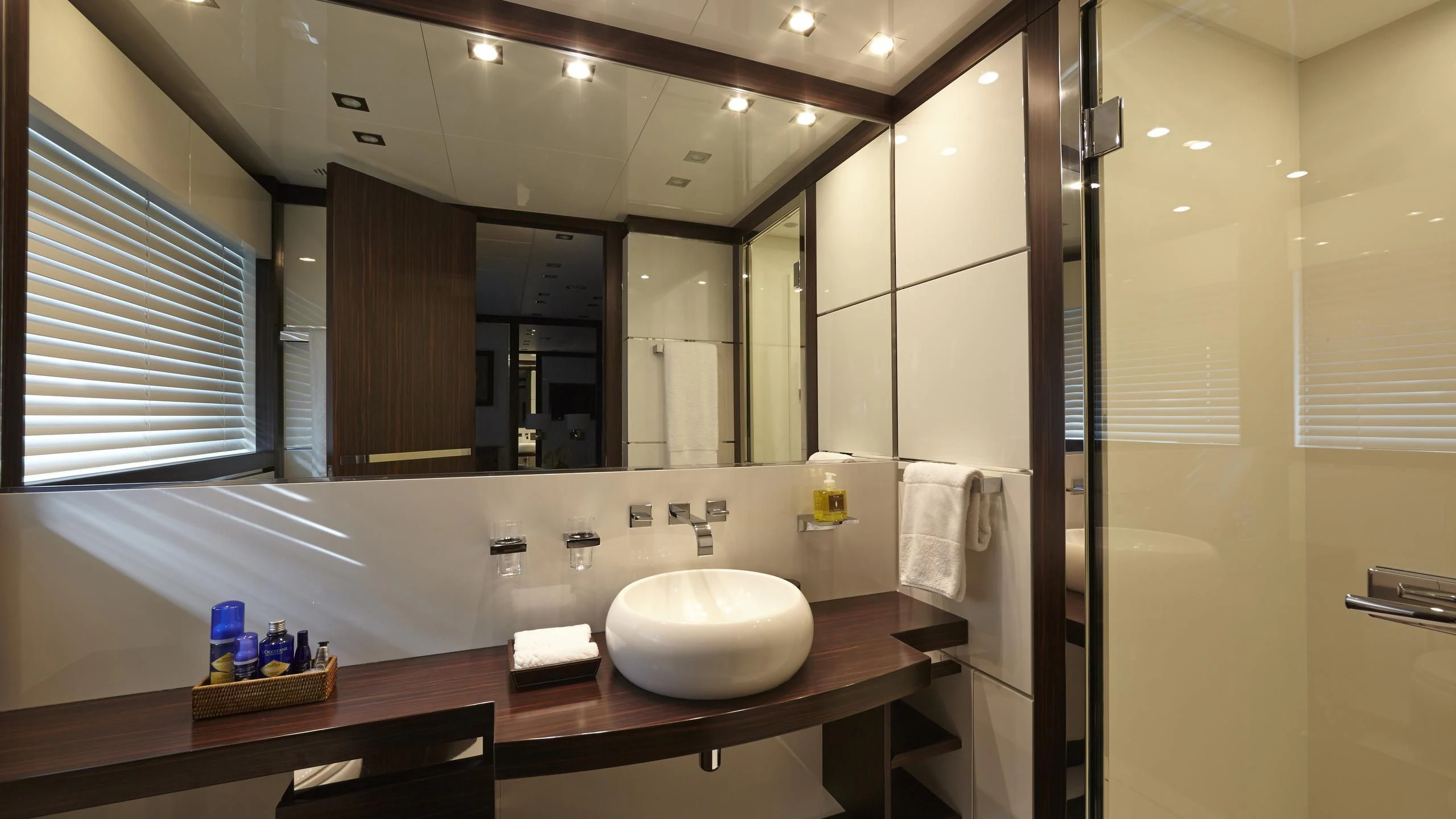 a bathroom with a large mirror aboard ANTELOPE III Yacht for Sale