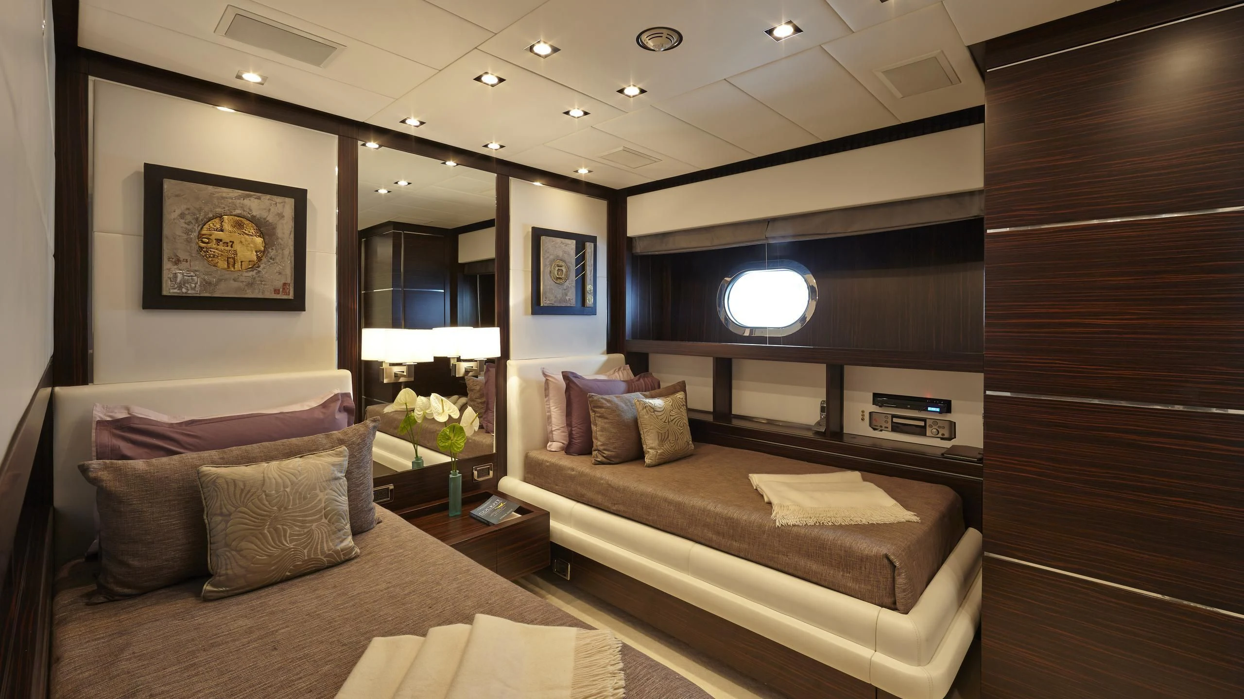 a room with a bed and a couch aboard ANTELOPE III Yacht for Sale